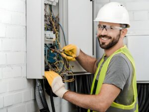 Electrician at breaker box